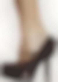 Heel-Wearing Man Shoots Image 1