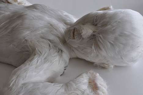 Feather-Covered Human Sculptures