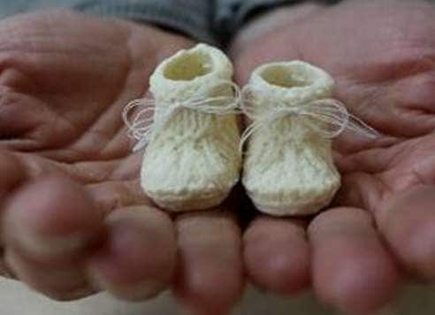 Lactate Infant Sneaker Sculptures