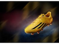 Yellow-Drenched Soccer Boots Image 2