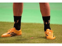 Yellow-Drenched Soccer Boots Image 5