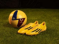 Yellow-Drenched Soccer Boots Image 7