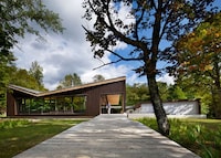Mirrored Forested Cabins Image 2