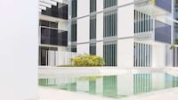 Serenely White Apartment Buildings Image 8