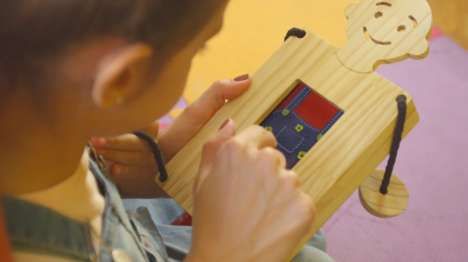 Phone-Powered Wooden Toys