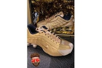 Athlete Collaborative Golden Sneakers Image 2
