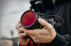 Scene-Neutralizing Photography Lenses