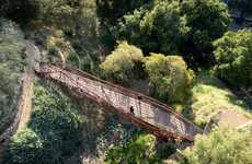 Robot-Built Suspension Bridges