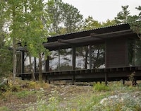 Tar-Coated Timber Homes