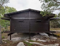 Tar-Coated Timber Homes Image 2