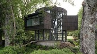 Round Glass-Wrapped Lakeside House