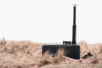 Rustic Fire-Powered Hot Tubs Image 1