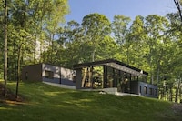 Sloped Dark Wooden Homes Image 3