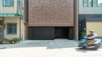 Perforated Facade Urban Home Image 3