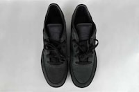 All-Black Collaborative Sneakers Image 1