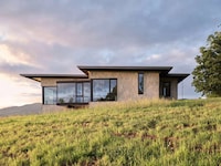 Perched Grassy Hillside Homes Image 2