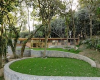 Curved Garden-Surrounding Linear Homes Image 1
