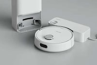 Plumbing-Attached Robotic Vacuums