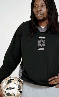 Traditional Football-Themed Fashion Image 3