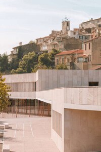 Low-Lying Limestone-Clad Schools Image 1
