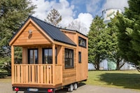 Author-Honoring Compact Homes Image 1
