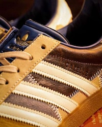 Collaborative Textual Patchwork Sneakers Image 1