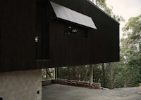 Angular Black Cantilevered Homes