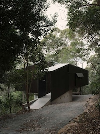 Angular Black Cantilevered Homes Image 3