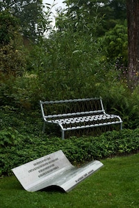 Tree-Intertwined Metal Benches Image 3