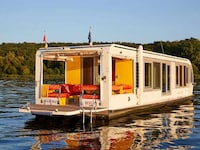 Solar-Powered Compact Houseboats Image 3
