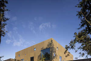 Gold-Tonal Metal Building Extensions: Rørbæk og Møller Arkitekter ...