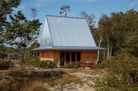 Hat-Shaped Metal-Topped Holiday Cabins Image 2