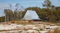 Hat-Shaped Metal-Topped Holiday Cabins Image 3