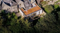 Limestone-Clad Expansive Extensions Image 3