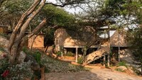 Tree-Surrounded Mud-Walled Residences Image 3
