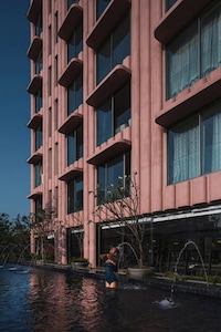 Pink Fluted Concrete Apartments Image 4