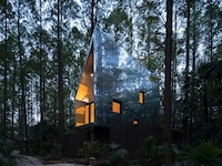 Artful Elevated Timber Treehouses Image 1