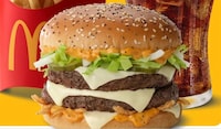 Stacked Quarter-Pound Burgers Image 1