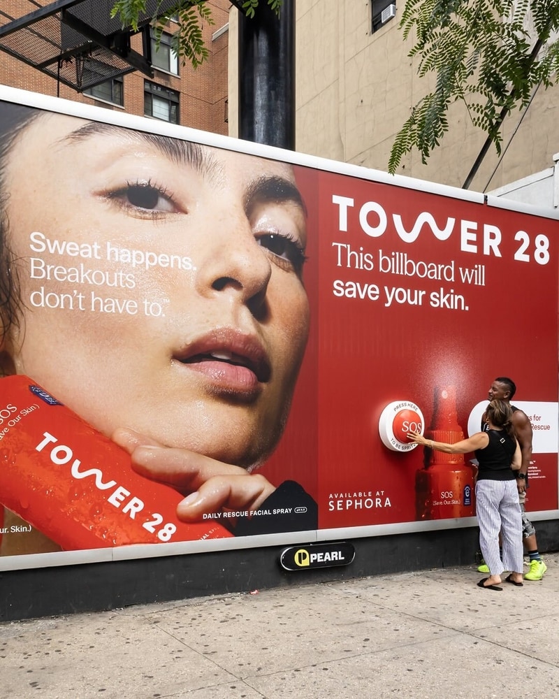 Tower 28 interactive OOH billboard NYC SOS spray activation