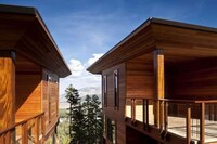 Glowing Mountainside Houses Image 3