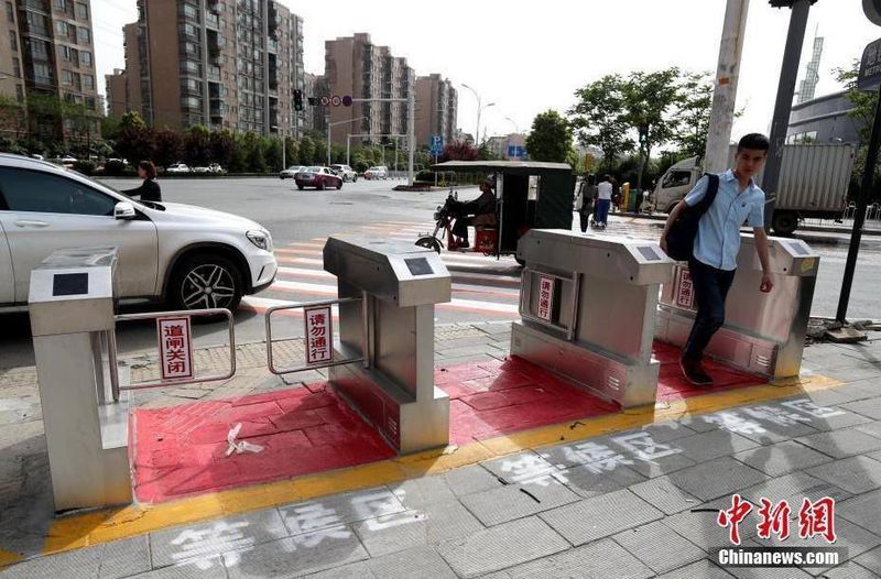 Safety-Enforcing Crosswalk Gates