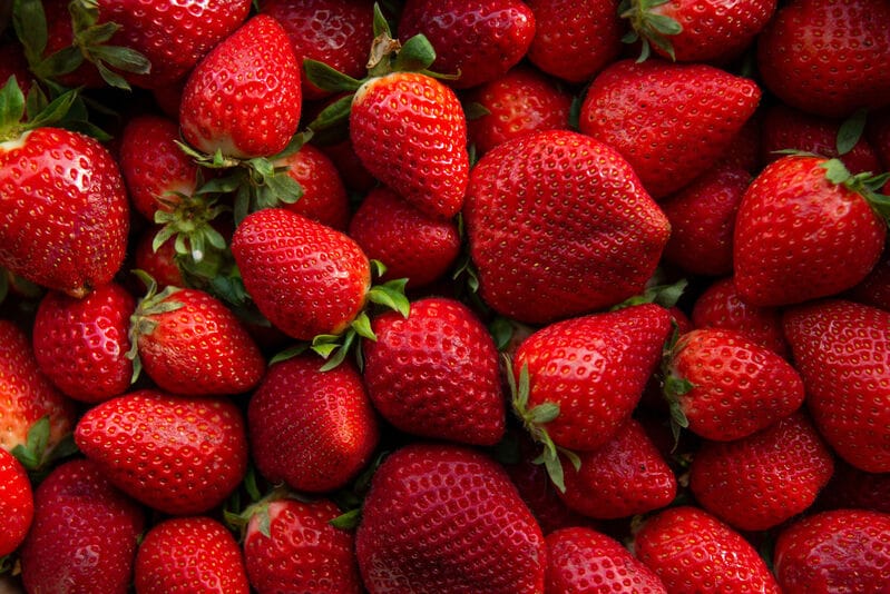 Premium AI Image  Fresh and sweet strawberrys background A close up of  strawberry