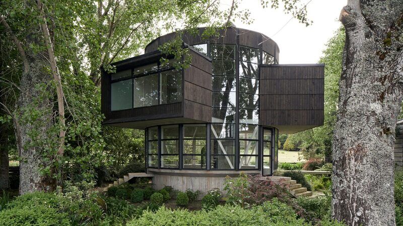 Round Glass-Wrapped Lakeside House