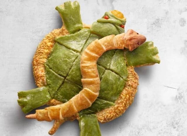 Celebratory Serpent-Shaped Pizzas